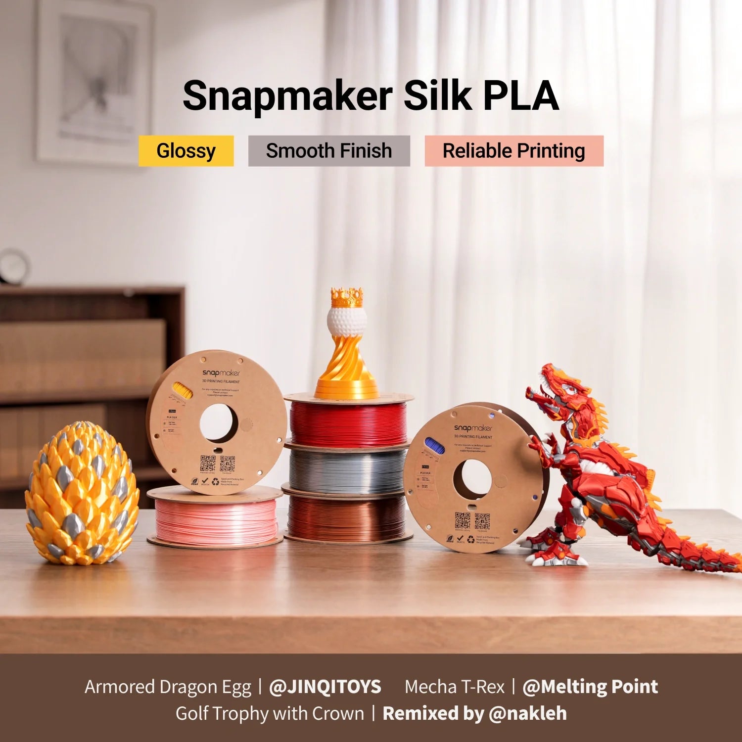 Glossy 3D prints made with Silk PLA Filament (RFID) beside colorful RFID filament spools.